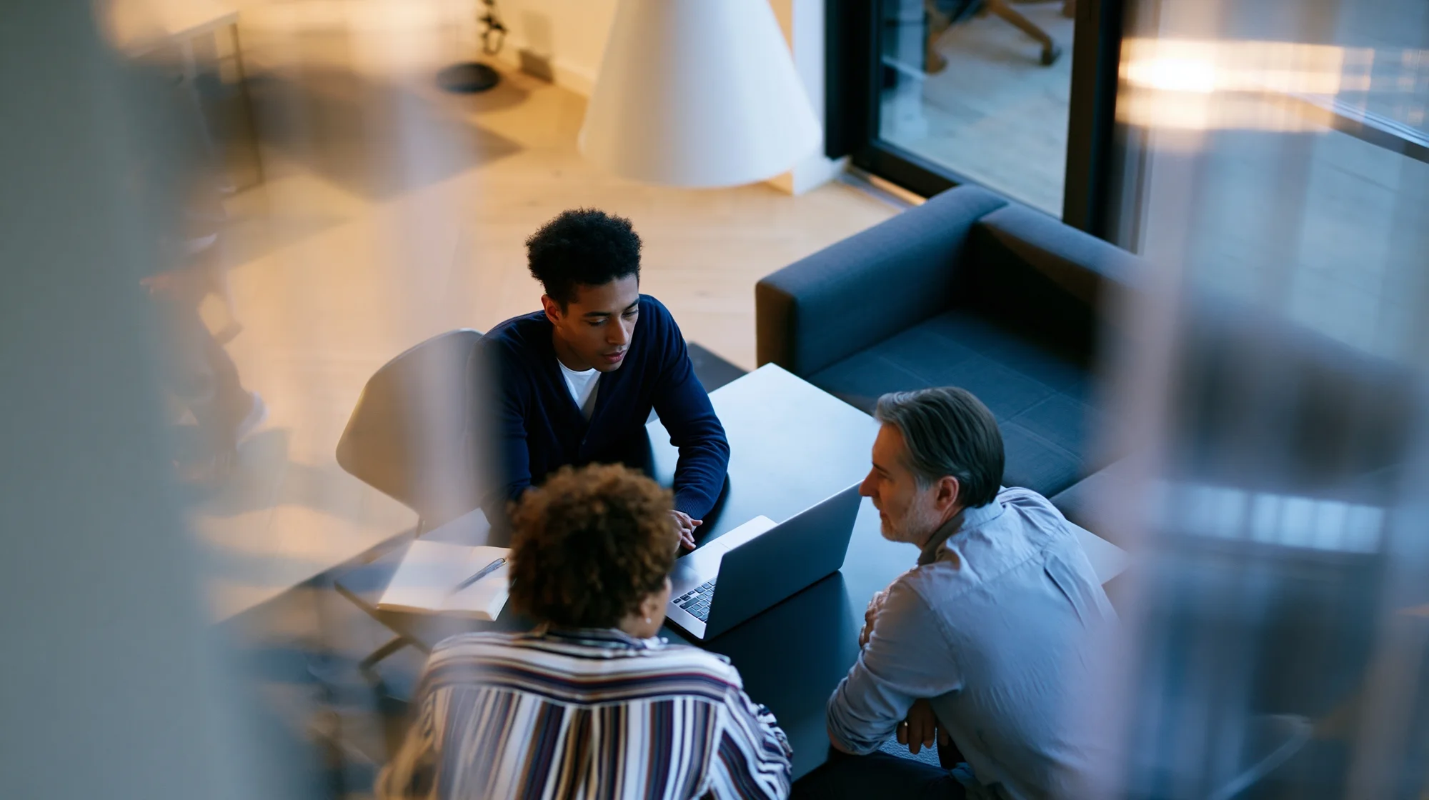 A leadership team working through a plan around a table